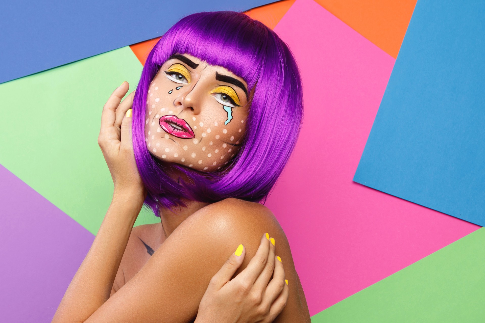 Model in creative image with pop art makeup